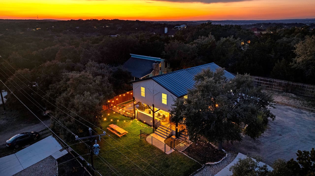 Cosmic Cowboy Retreat aerial view at sunset over hill country